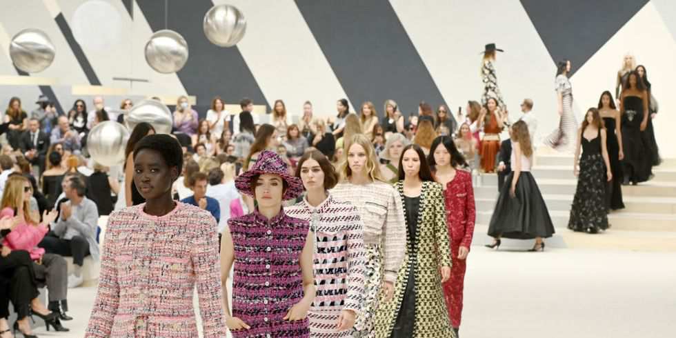 Streamlined Chanel collection shines in Paris despite catwalk crasher   Chanel  The Guardian